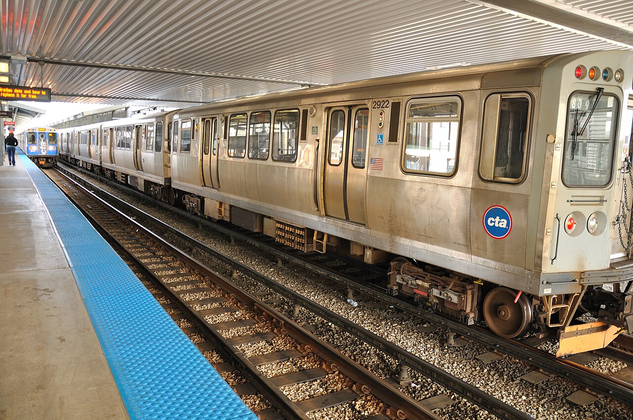 Two generations of CTA trains at Howard Station in 2010